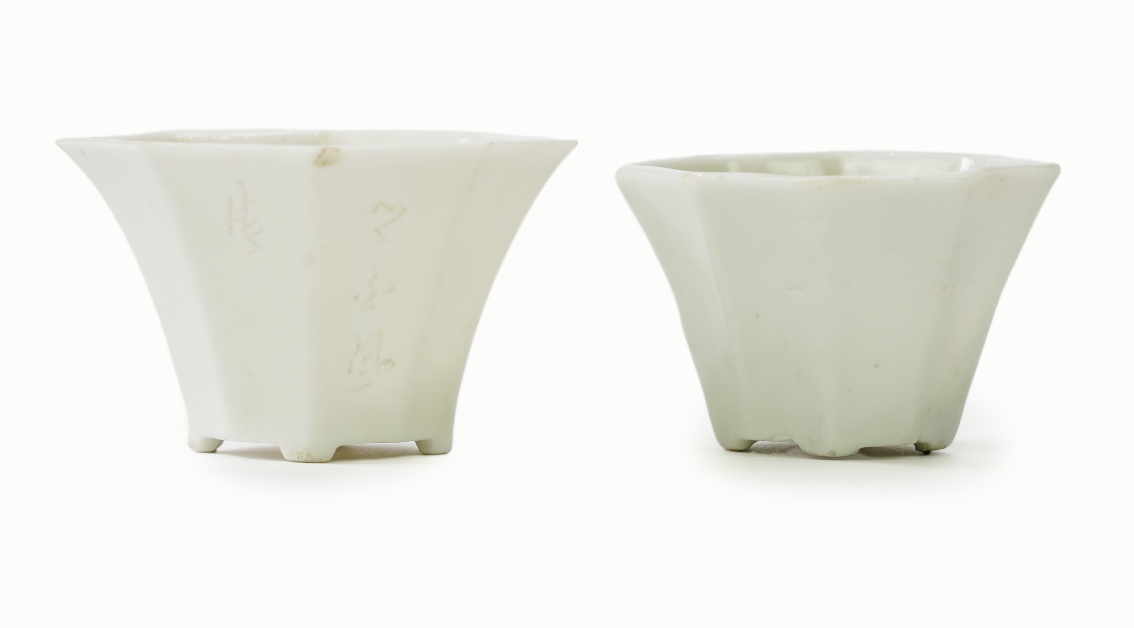 Two Chinese Dehua blanc de chine octagonal cups, Kangxi period